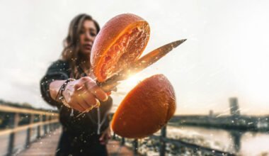 woman slicing an orange