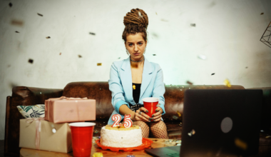 person celebrating but looking sad