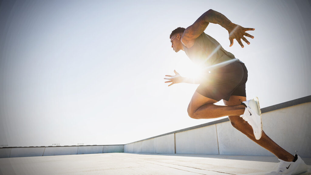 man sprinting in sunlight