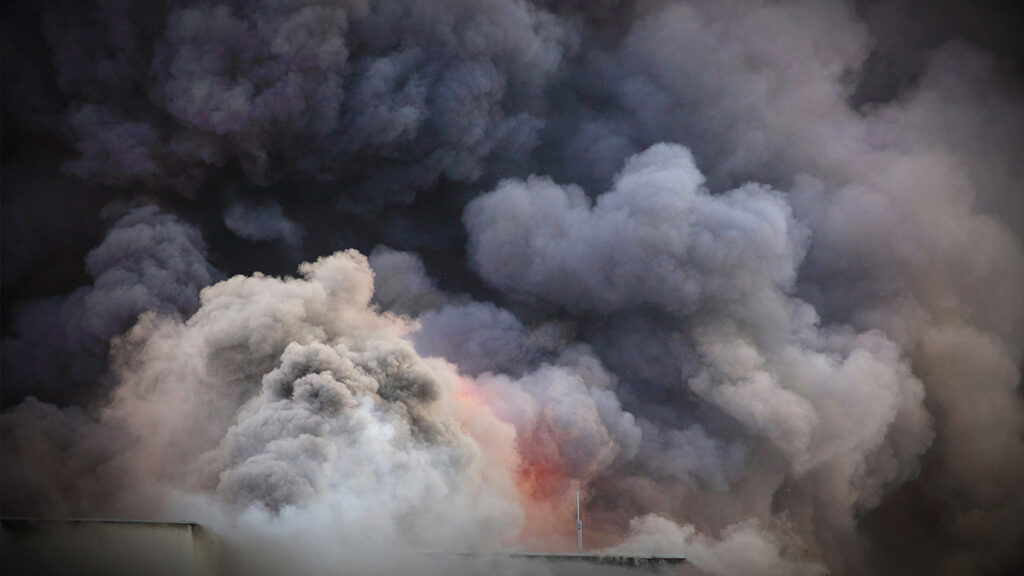 Smoke billows from an explosion.