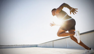 man sprinting in sunlight